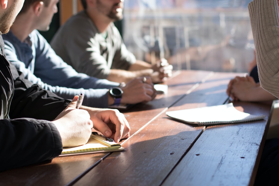 Detail of business people having meeting at cafe.